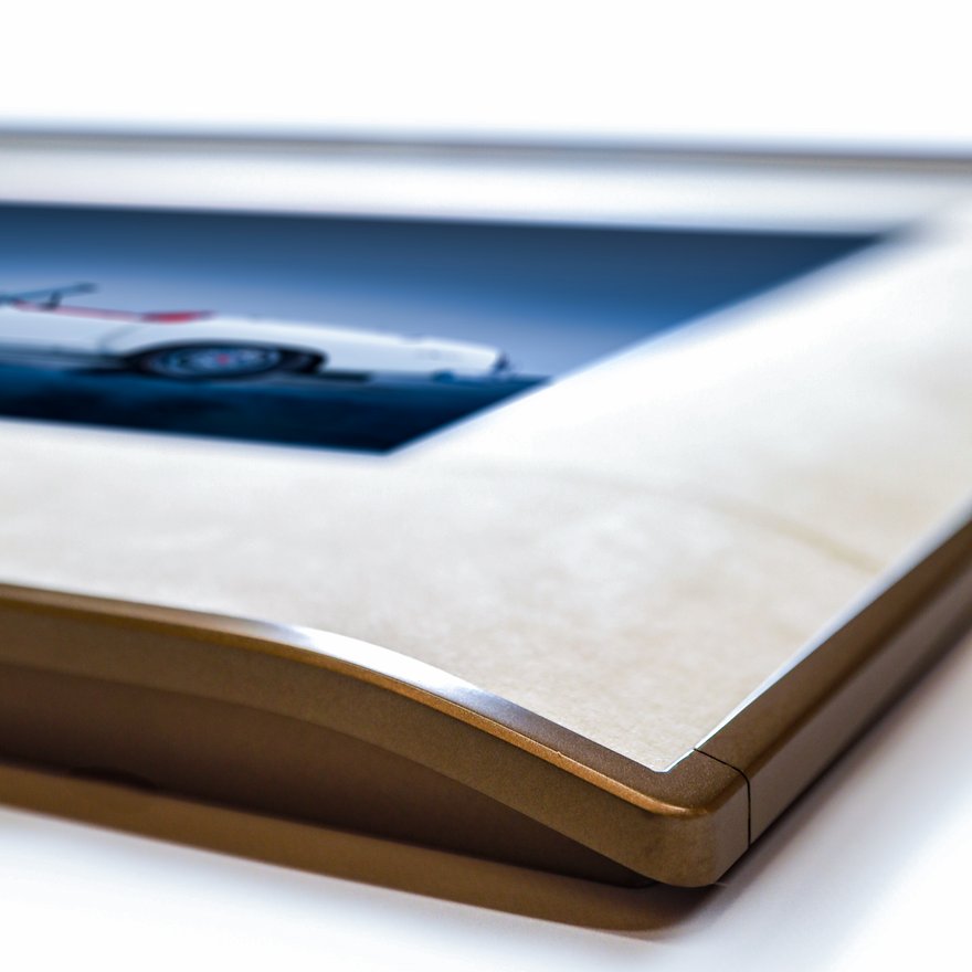 Close-up of an E-Ink picture frame edge, matboard, and slim metal profile