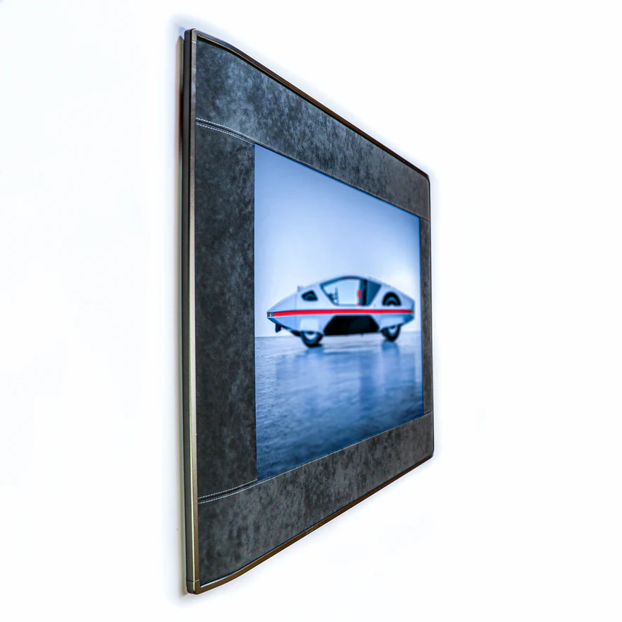 Slim wall-mounted color E-Ink frame viewed from the side showing thin profile