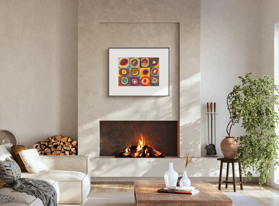 Color E-Ink frame displaying artwork above a fireplace in a hotel suite lounge