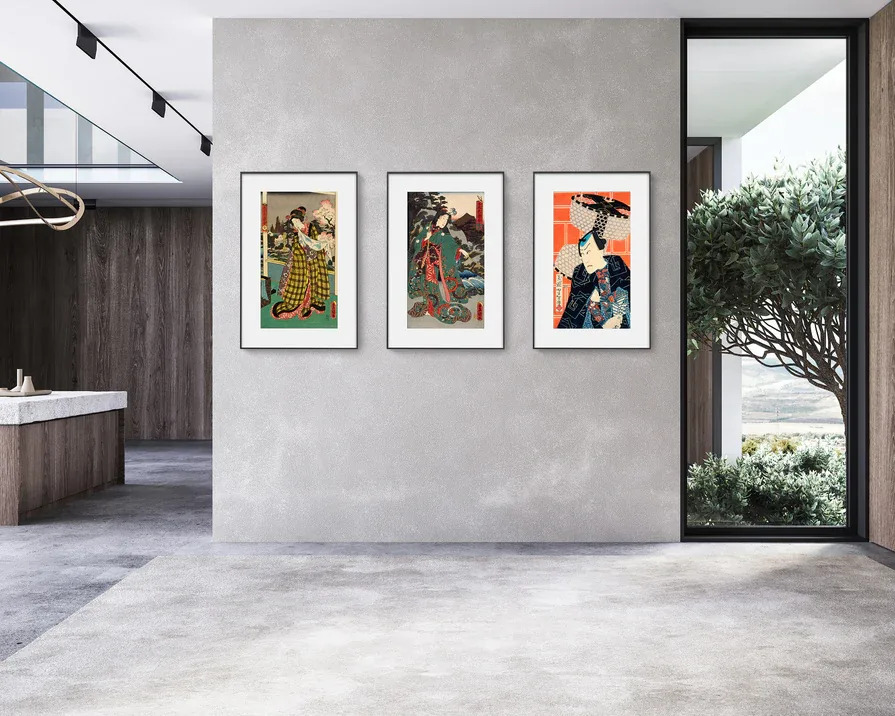 Three color E-Ink art frames arranged on a modern wall